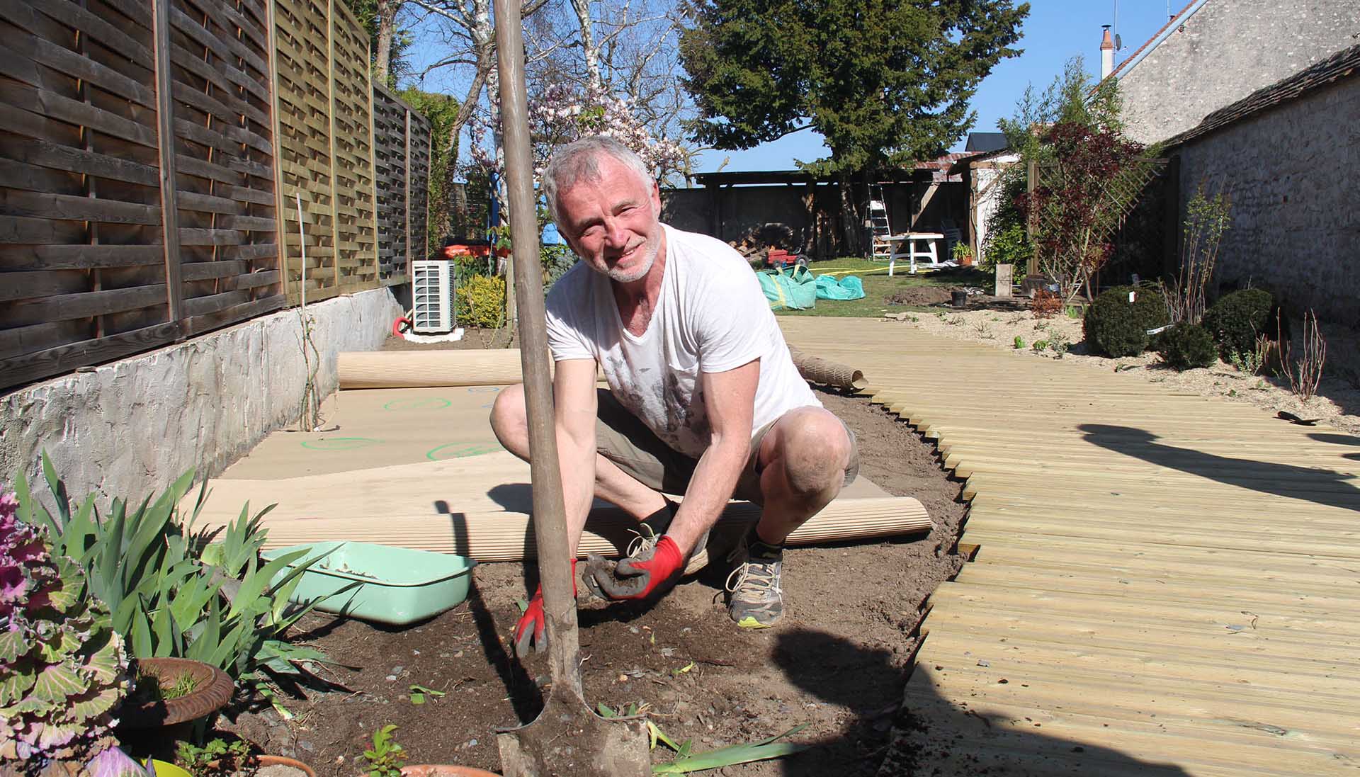 Man planting his own landscaped garden